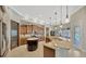 Open floor plan shows the gourmet kitchen, island, breakfast nook, and outdoor living area at 4411 Culbreath Rd, Valrico, FL 33596