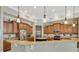 Gourmet kitchen with granite countertops, stainless steel appliances, and custom cabinetry at 4411 Culbreath Rd, Valrico, FL 33596