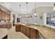Gourmet kitchen with granite countertops, tile flooring, and a view of the backyard at 4411 Culbreath Rd, Valrico, FL 33596