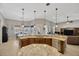 Kitchen with granite countertops overlooking a living area with a view of a pool at 4411 Culbreath Rd, Valrico, FL 33596