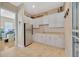 Kitchenette area with white cabinetry, stainless steel appliances, and granite countertops at 4411 Culbreath Rd, Valrico, FL 33596