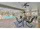 Expansive screened lanai with tile flooring, dining area, and a stunning pool view at 4411 Culbreath Rd, Valrico, FL 33596