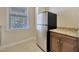 Laundry area features a stainless steel refrigerator and granite countertop at 4411 Culbreath Rd, Valrico, FL 33596