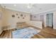 A versatile loft area with a seating area, wood floors and decorative wall art at 4411 Culbreath Rd, Valrico, FL 33596