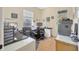 Well-lit home office with wood floors, black desk, and direct access to backyard at 4411 Culbreath Rd, Valrico, FL 33596