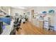 Large office space with multiple workstations, ample storage, and natural light at 4411 Culbreath Rd, Valrico, FL 33596