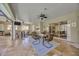 Elegant covered patio featuring a dining table, a ceiling fan, and an outdoor kitchen with a grill at 4411 Culbreath Rd, Valrico, FL 33596