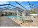 The refreshing screened-in pool has an attached spa and spacious patio, perfect for relaxing and entertaining at 4411 Culbreath Rd, Valrico, FL 33596