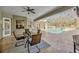 Inviting pool area featuring an outdoor dining set, hot tub, and screened enclosure at 4411 Culbreath Rd, Valrico, FL 33596