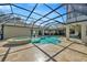 The screened-in pool and spa area offers a tranquil escape with ample patio space for entertaining guests at 4411 Culbreath Rd, Valrico, FL 33596
