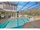 The sparkling pool features a spa and screen enclosure, providing a luxurious outdoor experience at 4411 Culbreath Rd, Valrico, FL 33596
