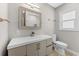Stylish bathroom with a contemporary vanity, brushed gold fixtures, and a framed mirror at 4500 22Nd S Ave, St Petersburg, FL 33711
