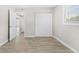 Bright bedroom with wood-look floors, large closet, and natural light from the window at 4500 22Nd S Ave, St Petersburg, FL 33711