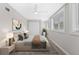 Cozy bedroom featuring neutral walls, ceiling fan, a double closet, and two large, bright windows at 4500 22Nd S Ave, St Petersburg, FL 33711