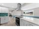 Modern kitchen boasting stainless steel appliances, white countertops, and ample cabinet space at 4500 22Nd S Ave, St Petersburg, FL 33711