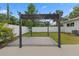 View of the backyard featuring a concrete pad and pergola with a privacy fence in the background at 4500 22Nd S Ave, St Petersburg, FL 33711