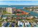 An aerial shot displaying a waterfront home with dock access along a waterway near a condo community at 4959 58Th S Ave, St Petersburg, FL 33715