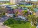 Aerial view of a waterfront home with lush landscaping, pool, and private boat dock on a sunny day at 4959 58Th S Ave, St Petersburg, FL 33715