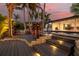 Multi-tiered deck and pool area with lounge seating, perfect for outdoor relaxation and entertaining at 4959 58Th S Ave, St Petersburg, FL 33715