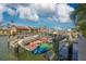This dock features watercraft including a dinghy and kayaks, making it perfect for boating enthusiasts at 4959 58Th S Ave, St Petersburg, FL 33715