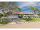Charming single-story home with a manicured lawn, brick driveway and mature trees at 4959 58Th S Ave, St Petersburg, FL 33715