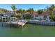 Charming waterfront home with a private boat dock, lush landscaping, and serene water views at 4959 58Th S Ave, St Petersburg, FL 33715