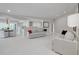 Open living area with view of modern sofas, dining area, and a bright kitchen at 4959 58Th S Ave, St Petersburg, FL 33715