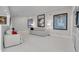 Bright living room features modern sofas, stylish art, and sleek tile flooring at 4959 58Th S Ave, St Petersburg, FL 33715