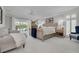 Bright main bedroom featuring a ceiling fan, and balcony access at 4959 58Th S Ave, St Petersburg, FL 33715