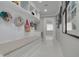 Mud room with built in bench, neutral walls, white trim, and hooks for storage at 4959 58Th S Ave, St Petersburg, FL 33715