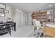 An office featuring a piano, desk, bookcase, and multiple awards on display at 4959 58Th S Ave, St Petersburg, FL 33715