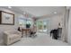 Bright office featuring a view of the pool, an accent chair, and a desk at 4959 58Th S Ave, St Petersburg, FL 33715