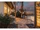 Serene waterfront patio featuring a comfortable seating area and lush tropical landscaping at 4959 58Th S Ave, St Petersburg, FL 33715
