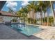 Beautiful pool and patio area with palm trees providing a tropical atmosphere for relaxation and leisure at 4959 58Th S Ave, St Petersburg, FL 33715