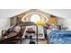 Eclectic attic space with eye-shaped window and storage at 5604 N Cherokee Ave, Tampa, FL 33604