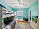 This bedroom features a playful style with a bunk bed, rug, and colorful decor at 5604 N Cherokee Ave, Tampa, FL 33604