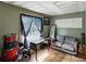 Eclectic bonus room with playful decor, wood-panel walls, and a cozy seating area at 5604 N Cherokee Ave, Tampa, FL 33604