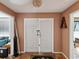Inviting entryway featuring a terra-cotta floor and a unique double-door entry at 5604 N Cherokee Ave, Tampa, FL 33604
