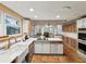 Bright, spacious kitchen with a central island and white countertops at 5604 N Cherokee Ave, Tampa, FL 33604