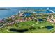 Breathtaking aerial view of waterfront community with golf course, ponds and lush greenery at 6059 Bahia Del Mar Blvd # 134, St Petersburg, FL 33715
