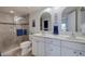 Bright bathroom with a double sink vanity and a glass-enclosed shower with elegant tile work at 6059 Bahia Del Mar Blvd # 134, St Petersburg, FL 33715