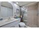 Updated bathroom featuring a glass-enclosed shower and modern fixtures at 6059 Bahia Del Mar Blvd # 134, St Petersburg, FL 33715