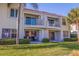 Condo building featuring balconies and patios with lush green surroundings at 6059 Bahia Del Mar Blvd # 134, St Petersburg, FL 33715