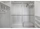 Organized walk-in closet featuring multiple shelves and rods for ample clothing and storage at 6059 Bahia Del Mar Blvd # 134, St Petersburg, FL 33715