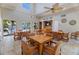 The bright clubhouse features high ceilings, ceiling fans, tables, and a wall-mounted television at 6059 Bahia Del Mar Blvd # 134, St Petersburg, FL 33715