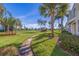 Scenic view of a well-maintained community with lush landscaping and palm trees at 6059 Bahia Del Mar Blvd # 134, St Petersburg, FL 33715