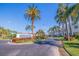 The Vista Verde East entrance is framed by palm trees and colorful flowers, setting a welcoming tone at 6059 Bahia Del Mar Blvd # 134, St Petersburg, FL 33715