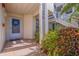 Condominium entrance with exterior stairs and a decorative wreath on the front door at 6059 Bahia Del Mar Blvd # 134, St Petersburg, FL 33715