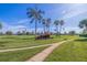 Lush green golf course with beautiful palm trees and clear blue skies, perfect for recreation at 6059 Bahia Del Mar Blvd # 134, St Petersburg, FL 33715