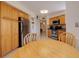 Eat-in kitchen has wood cabinets, stainless steel appliances, and tile flooring at 6059 Bahia Del Mar Blvd # 134, St Petersburg, FL 33715